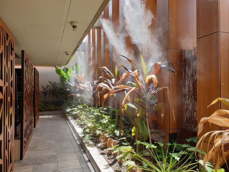 Pre-Cooling the air entering the coils of a commercial air-conditioner 			using a misting system